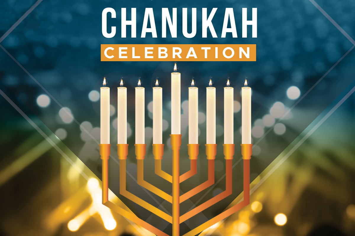 Chanukah celebration with lit menorah