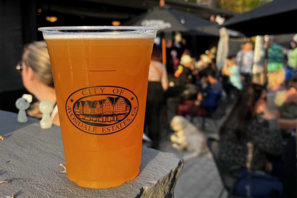 beer in city of Avondale Estates to go cup in outdoor brewery